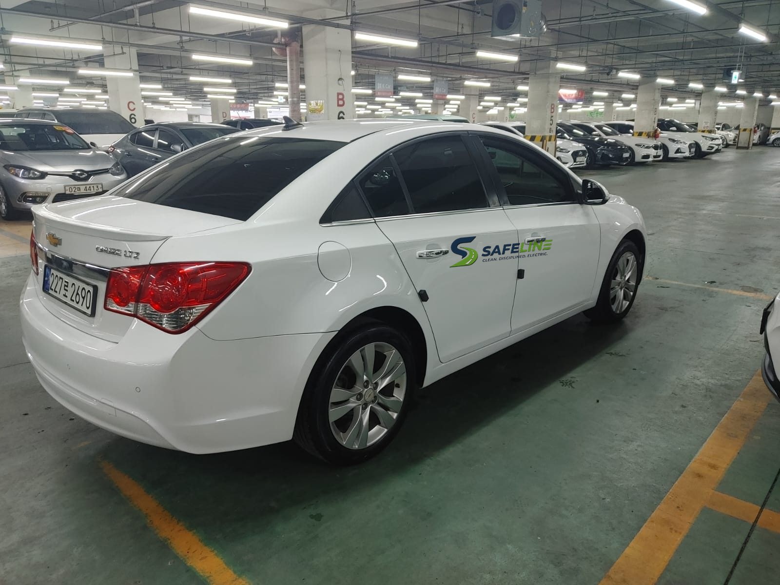 A SafeLine driver waiting beside the car on a corporate transfer